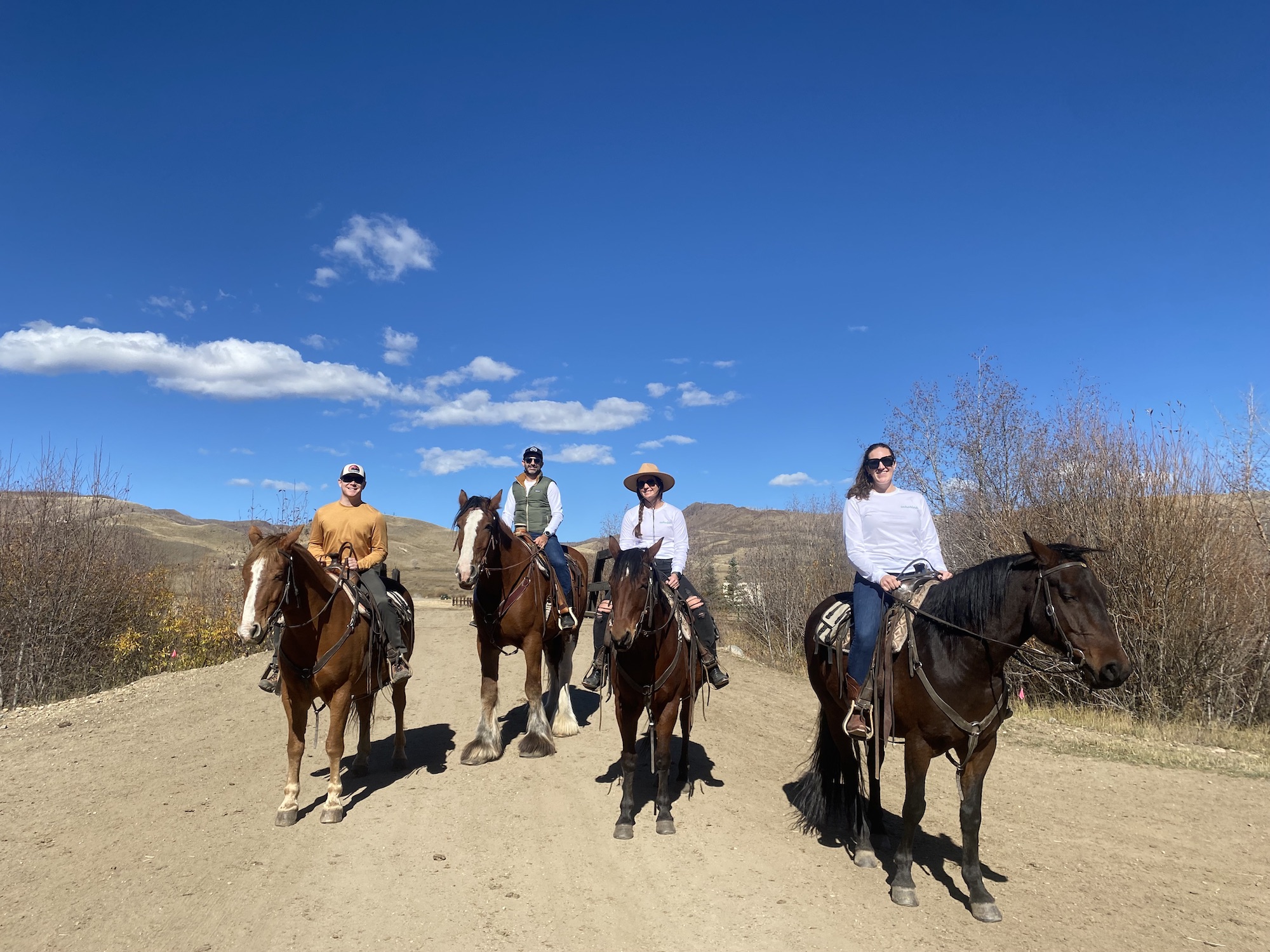 Echobind team members on a horseback ride
